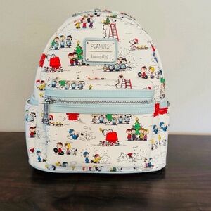 NWT LOUNGEFLY PEANUTS HAPPY HOLIDAYS MINI BACKPACK .